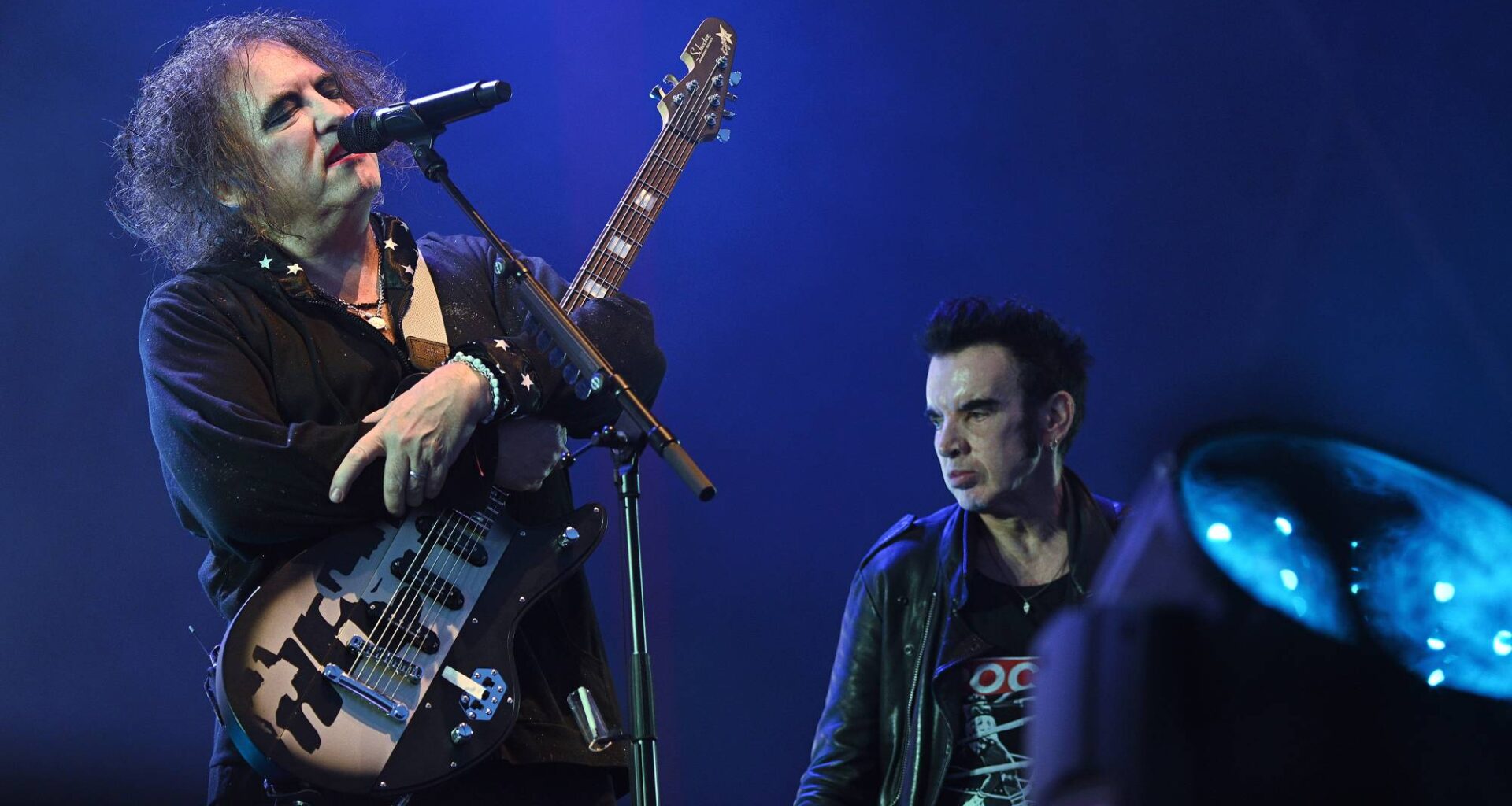 The Cure announce Simon Gallup's son, Eden, filling in for him on tour as he's "not well enough to play"