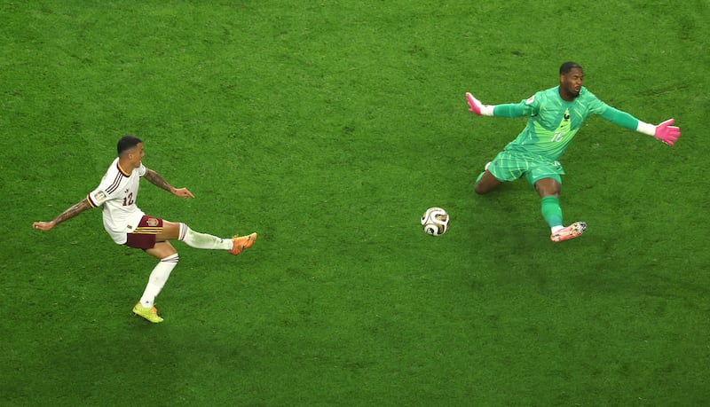 Pedro Porro scores Spain's second goal as he slots the ball past Mike Maignan of France. Photograph: Stacy Revere/Getty Images
