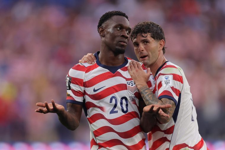 LOS ANGELES, CALIFORNIA - JUNE 12: Folarin Balogun #20 of the United States celebrates scoring his team's third goal with Christian Pulisic #10 during the FIFA World Cup 2026 Group D match between USA and Paraguay at Los Angeles Stadium on June 12, 2026 in Los Angeles, California. (Photo by Katelyn Mulcahy - FIFA/FIFA via Getty Images)