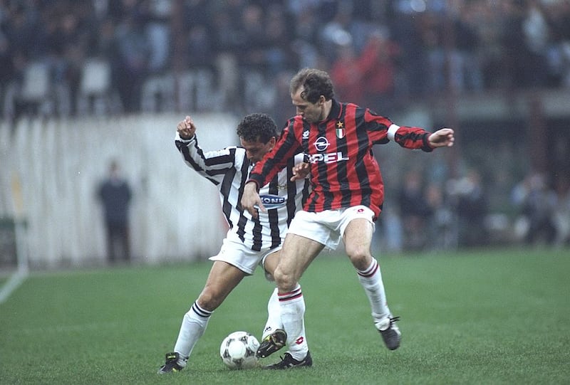 Franco Baresi (right) of AC Milan is tackled by Robertio Baggio of Juventus takes at the San Siro Stadium in Milan in 1995. Photograph: Allsport UK/Getty