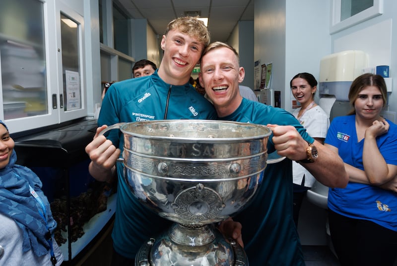 Mayo's Kobe McDonald and Ryan O'Donoghue with the Sam Maguire during the team visit to Temple Street Children's Hospital. Photograph: 
Tom Maher/Inpho