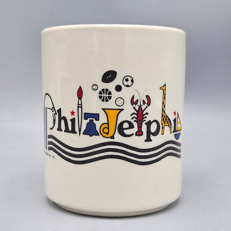 Frank Nofer's "Philadelphia" logo featured on a mug, one of many pieces of merchandise.