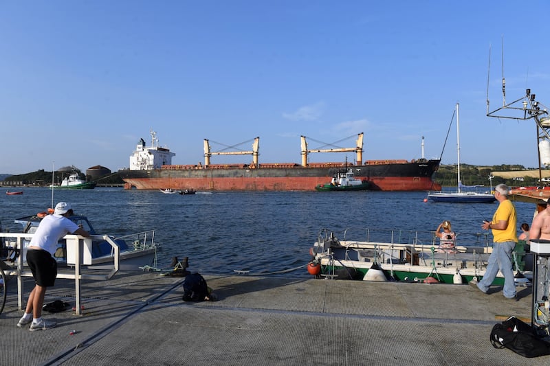The MV Matthew being escorted out of Cork on Friday after almost three years. Photograph: Provision