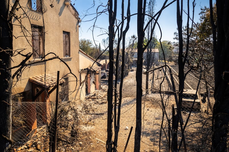 Burned houses in a residential area of the town of Ille sur Tet as a wildfire rages in the southern France. Photograph: Jean-Christophe Milhet/AFP via Getty Images
