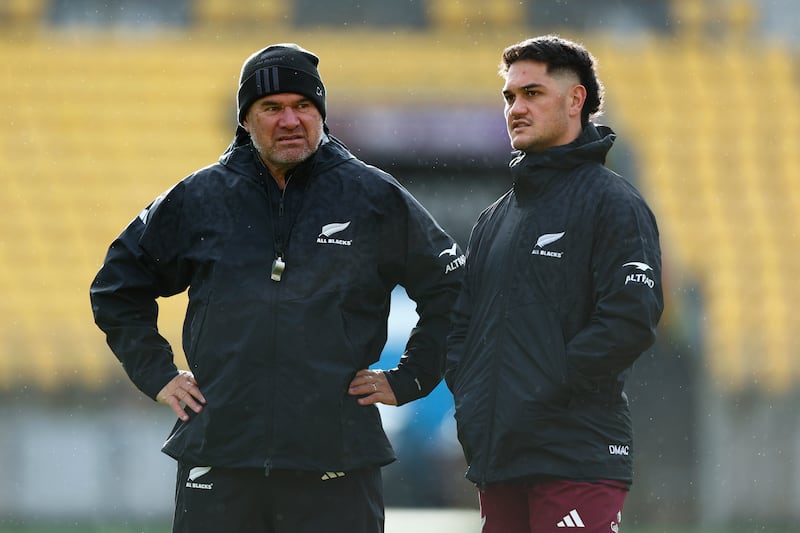 Dave Rennie talks to Quinn Tupaea during the captain's run in Wellington. Photograph: Hagen Hopkins/Getty Images