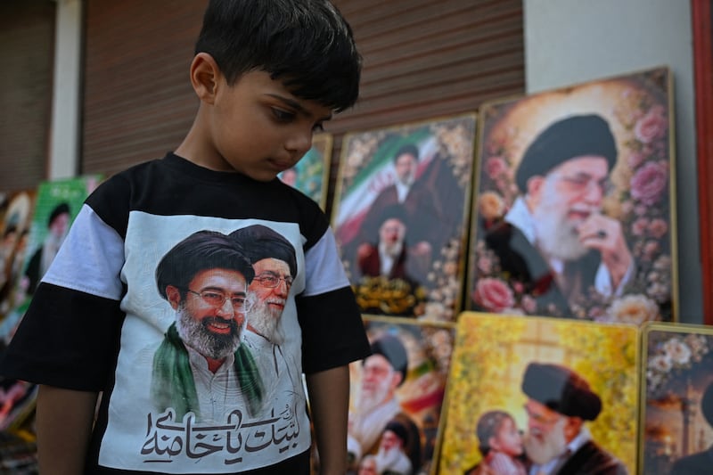 A Shiite Muslim boy mourns Iran's slain supreme leader Ayatollah Ali Khamenei, near Imambara in Budgam on Thursday. Photograph: Tauseef Mustafa/ AFP via Getty Images