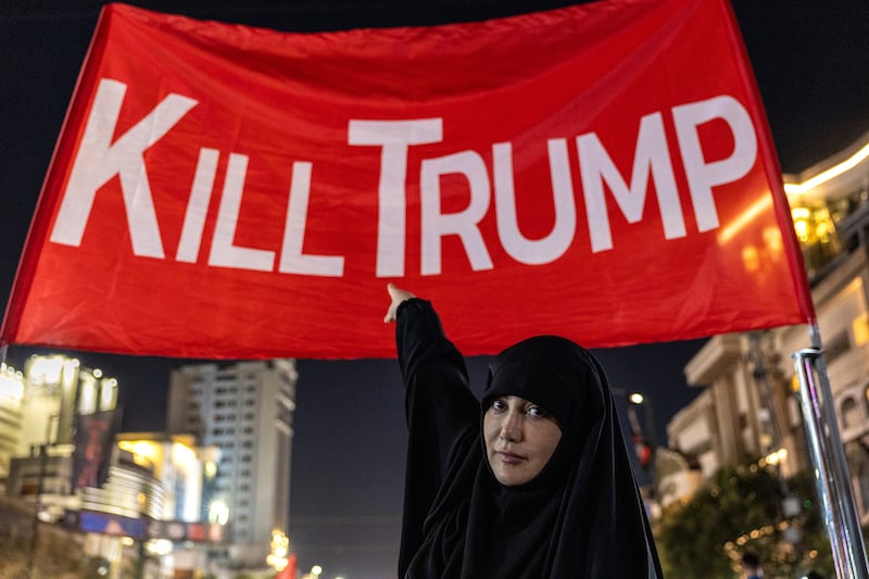 Mourners pose for photos under a banner set up in a main thoroughfare near the Imam Reza Shrine on Thursday in Mashhad, Iran. Photograph: John Moore/Getty Images