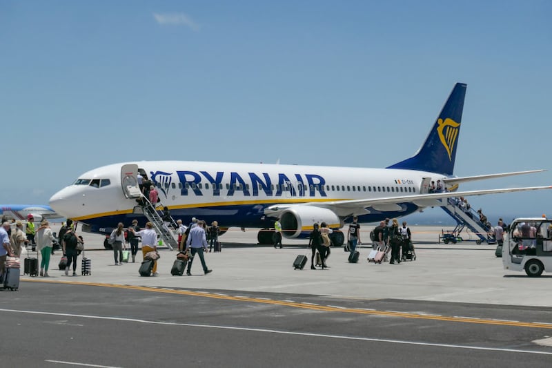 Passengers board a Ryanair plane at Tenerife. Photograph: Nicolas Economou/Getty