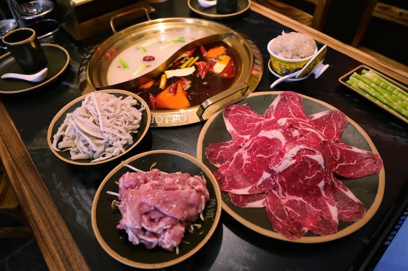 Chongqing Hotpot: Tender pork slices, premium thousand-layer tripe, premium marbled beef rib eyes, handcrafted fish roe shrimp paste and crunchy alpine bamboo shoots. Photograph: Bryan O’Brien