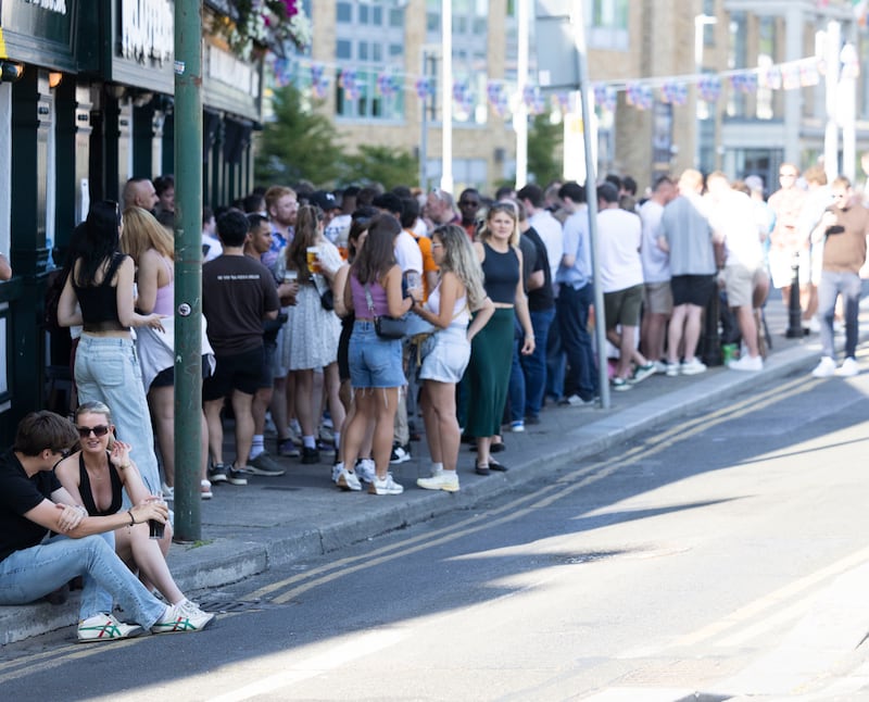 People enjoy after-work drinks outside McCafferty's at the Barge during hot weather. Photograph: Sam Boal/Collins Photos
