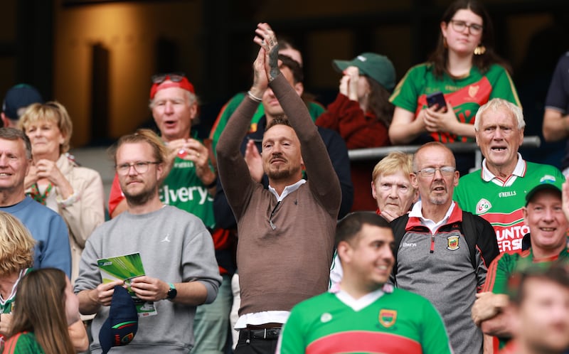Kobe McDonald's father, former Mayo footballer and coach Ciarán McDonald (centre), celebrates after the All-Ireland final win. Photograph: James Crombie/Inpho