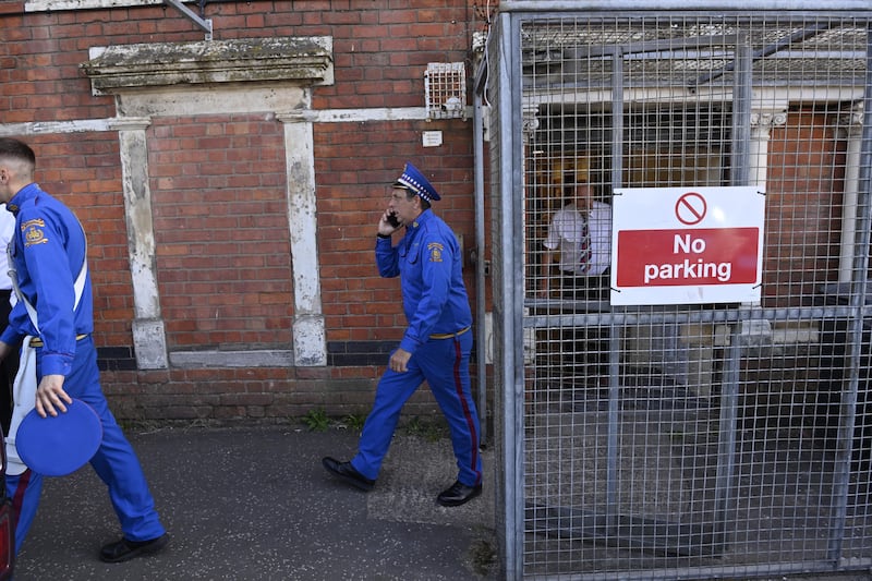 Band members of the Orange Order prepare at Clifton Street Orange Hall to parade on the streets in Belfast. Photo: EPA/Shutterstock