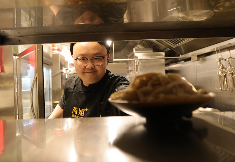 Chef Ran Yi at the pass in Chongqing Hotpot. Photograph: Bryan O'Brien