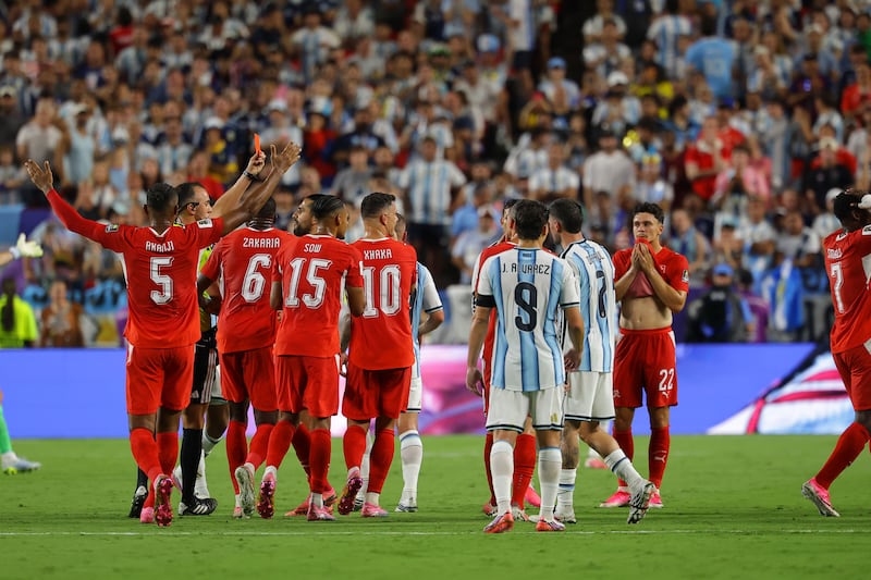 Referee Joao Pinheiro (L) sends off Breel Embolo of Switzerland (R) after showing him a second yellow card for simulation during the Fifa World Cup 2026 quarter-final between Argentina and Switzerland in Kansas City, Missouri, USA, on 11 July 2026. Photograph: Christopher Neundorf/EPA.