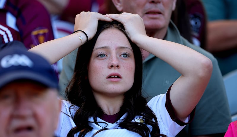 A Galway fan watches on during her team's defeat to Limerick in last Sunday's All-Ireland SHC final at Croke Park. Photograph: Ryan Byrne/Inpho