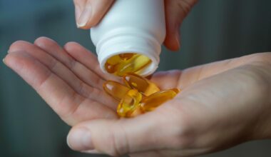 Woman Pouring Vitamin D Omega 3 Vitamin Supplements Hand