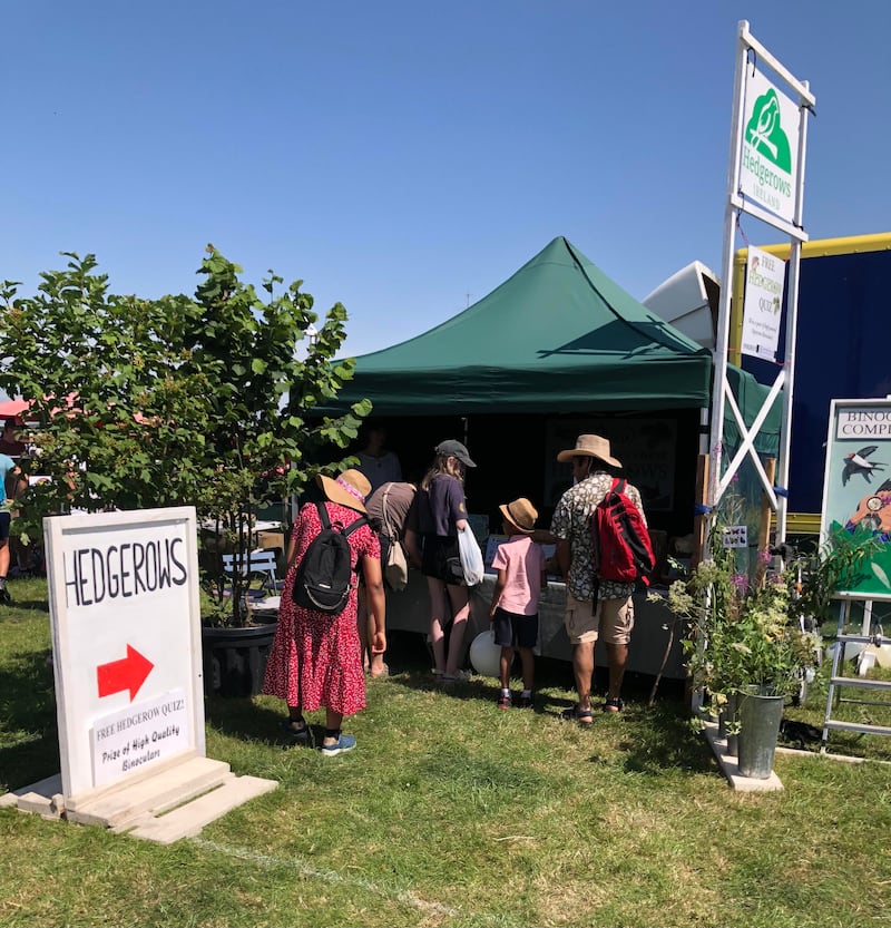 People take in the Hedgerows Ireland stand at the Bannow and Rathangan Farm Show in Co Wexford.