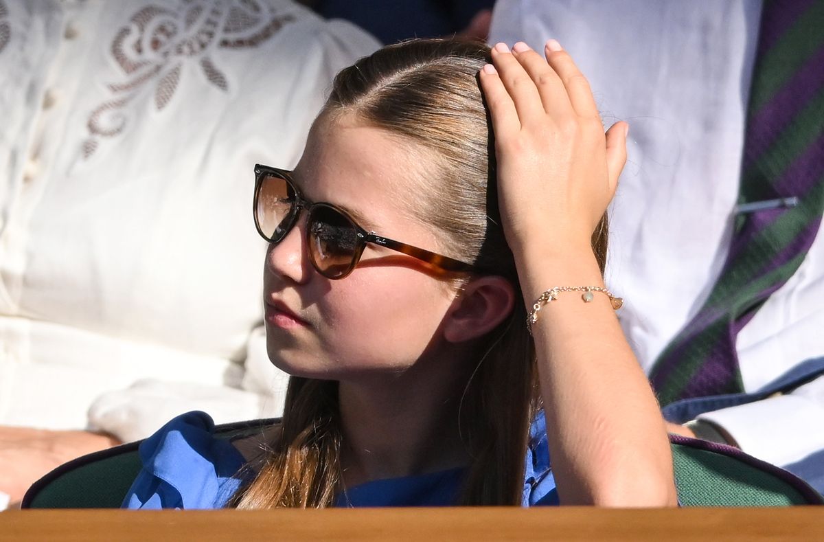 Princess Charlotte stunned in a cornflower blue Jenny Packham dress paired with a meaningful charm bracelet at Wimbledon.