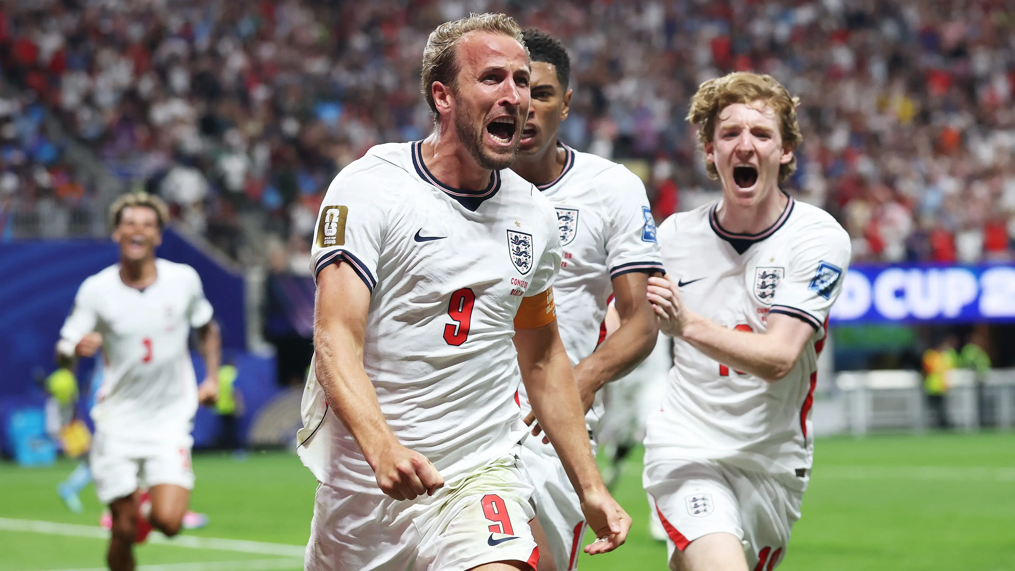  Harry Kane #9 of England celebrates with teammates Jude Bellingham #10 and Anthony Gordon #18 after scoring his team's first goal during the FIFA World Cup 2026 