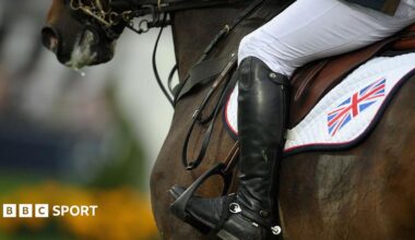 A close up of a horse and rider in action at an eventing competition
