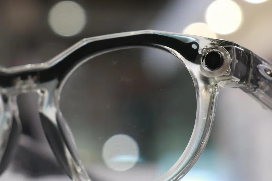 Close up of the camera installed in the frame of a pair of Meta AI glasses.