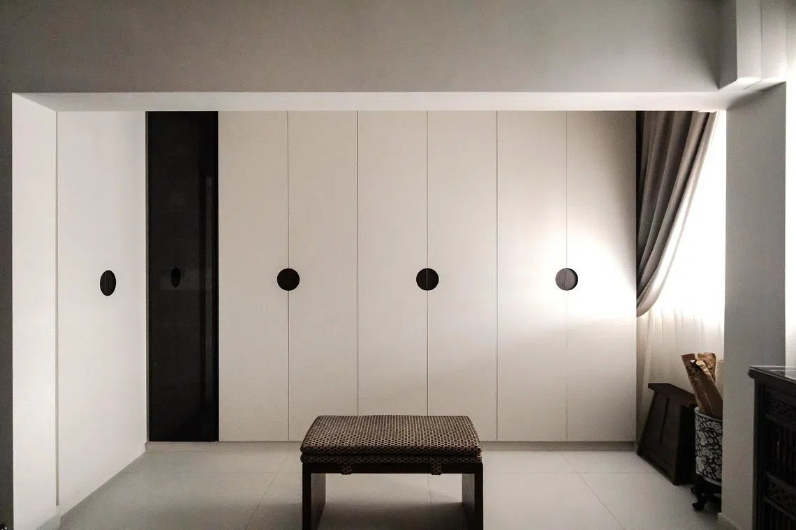 The cupboard space was formerly part of another bedroom, which was removed to create a bigger master suite.