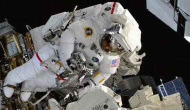 NASA astronaut Chris Williams works outside the International Space Station to swap out a malfunctioning wrist joint on the Canadarm2 robotic arm.