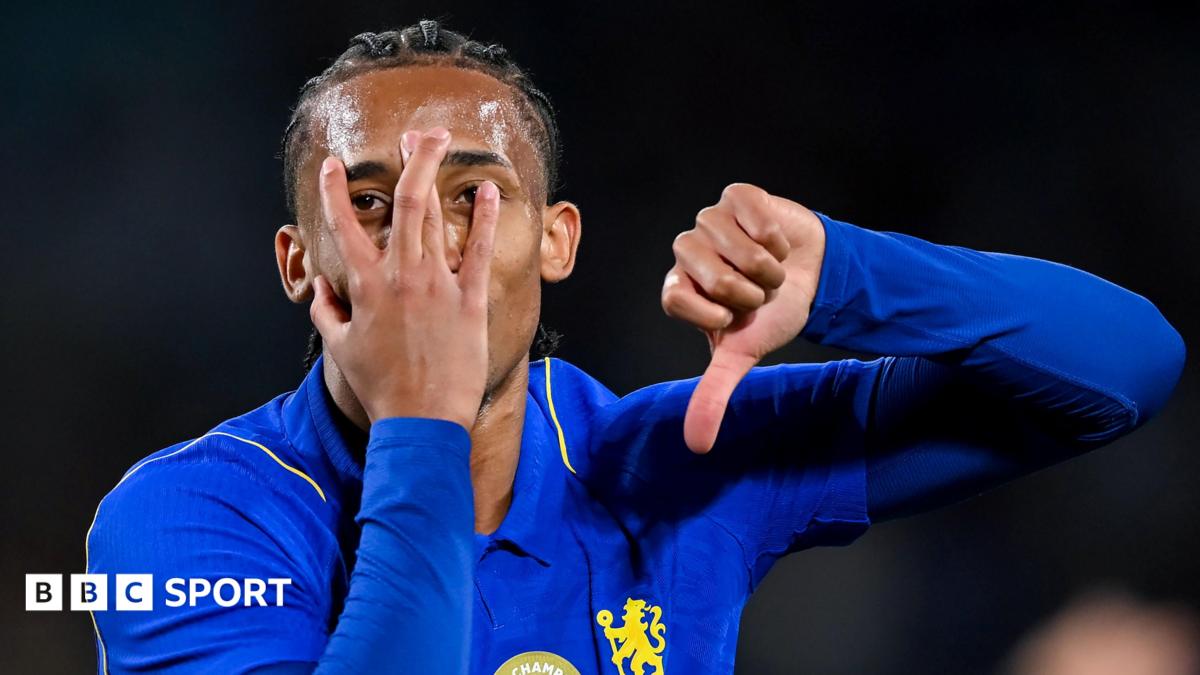 Joao Pedro partly covers his face with his hand
