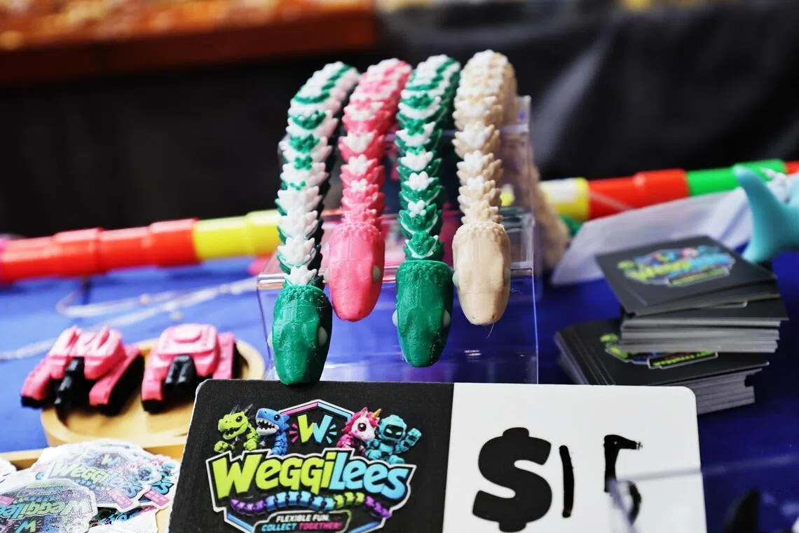 The 3D-printed wiggly snake, which have glow-in-the-dark eyes, are among several figurines made by Rui Qi.