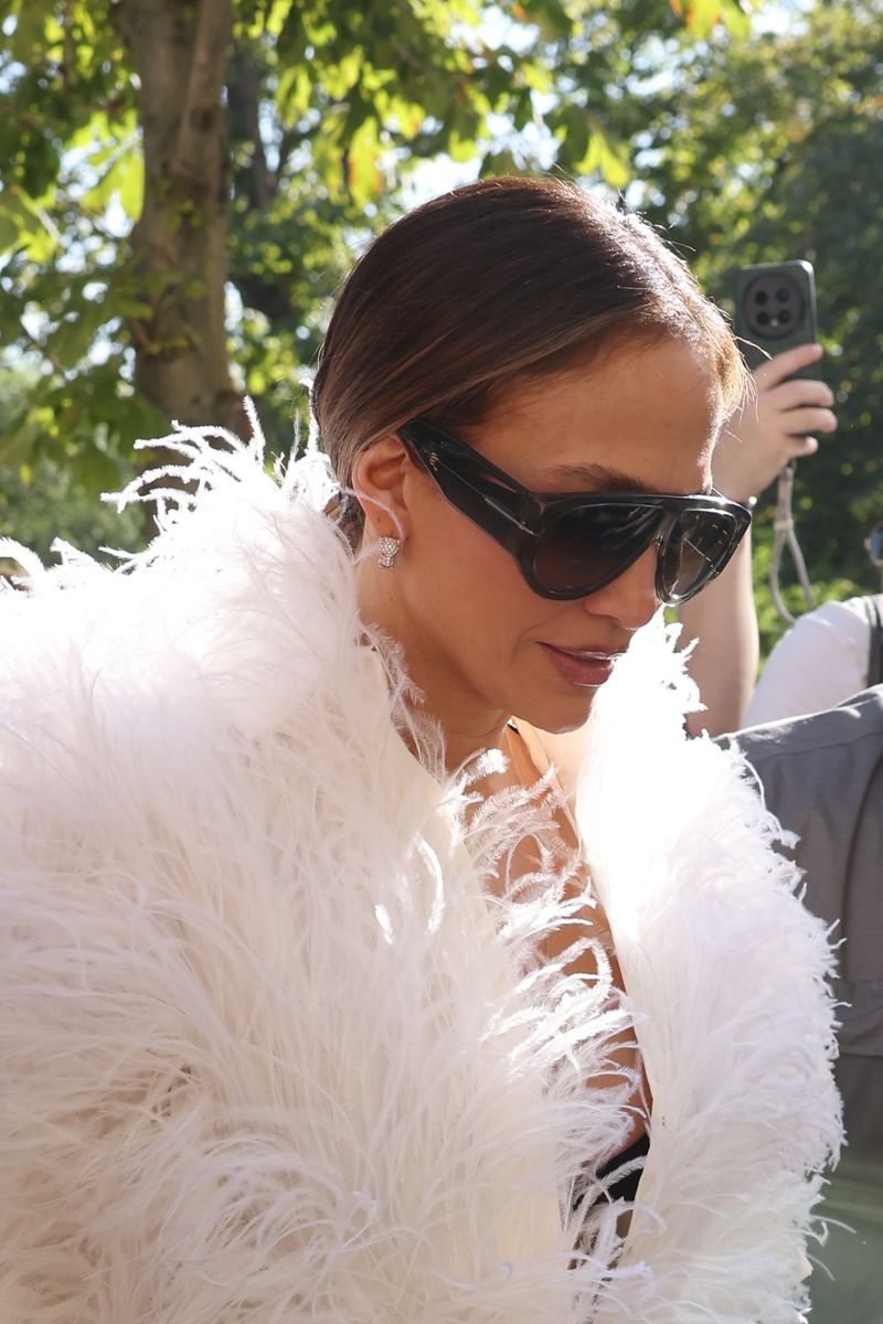 Jennifer Lopez turns heads with feathers and dark shades during Paris Fashion Week