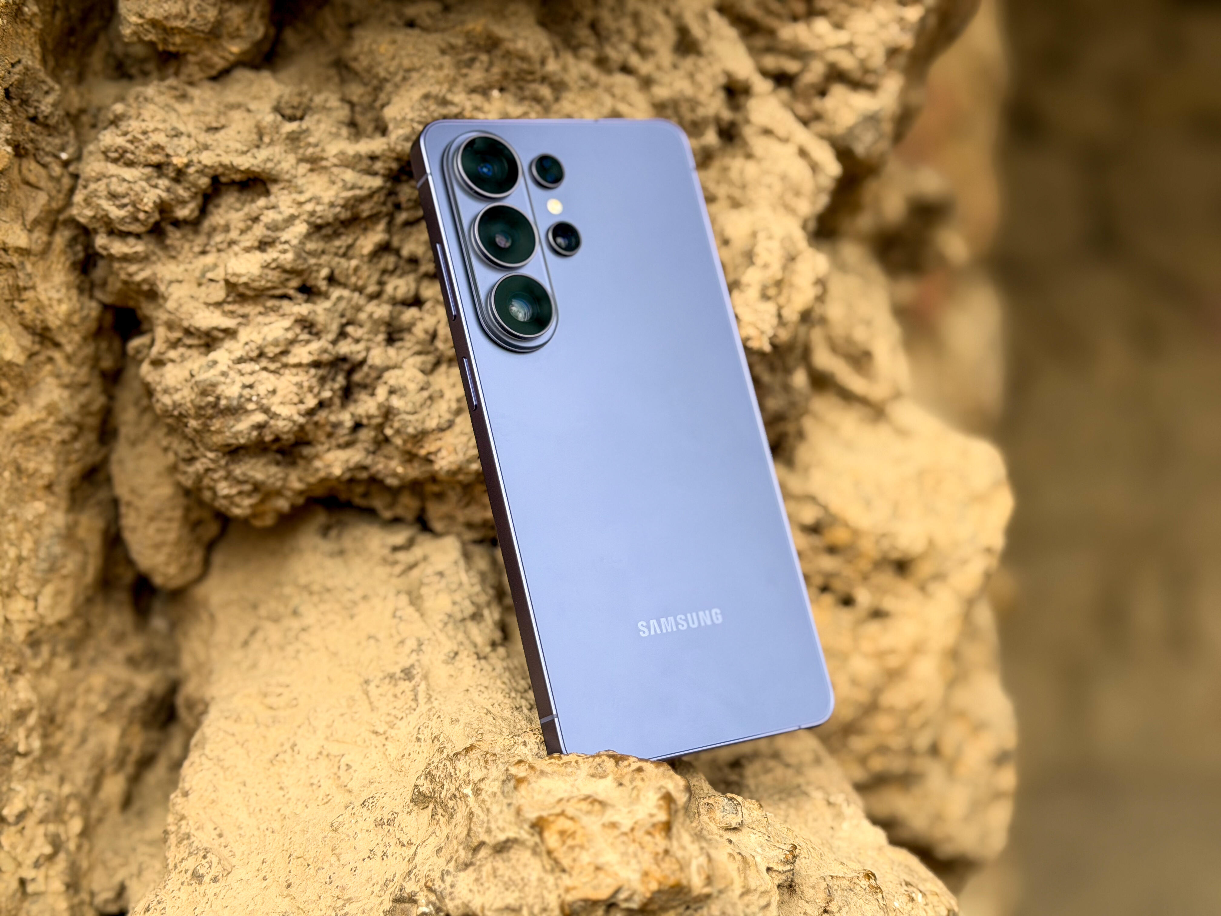 The Galaxy S26 Ultra sits on a rock formation