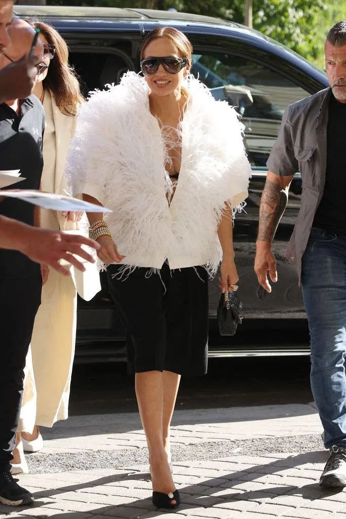 Jennifer Lopez wore Michael Kors white feather jacket