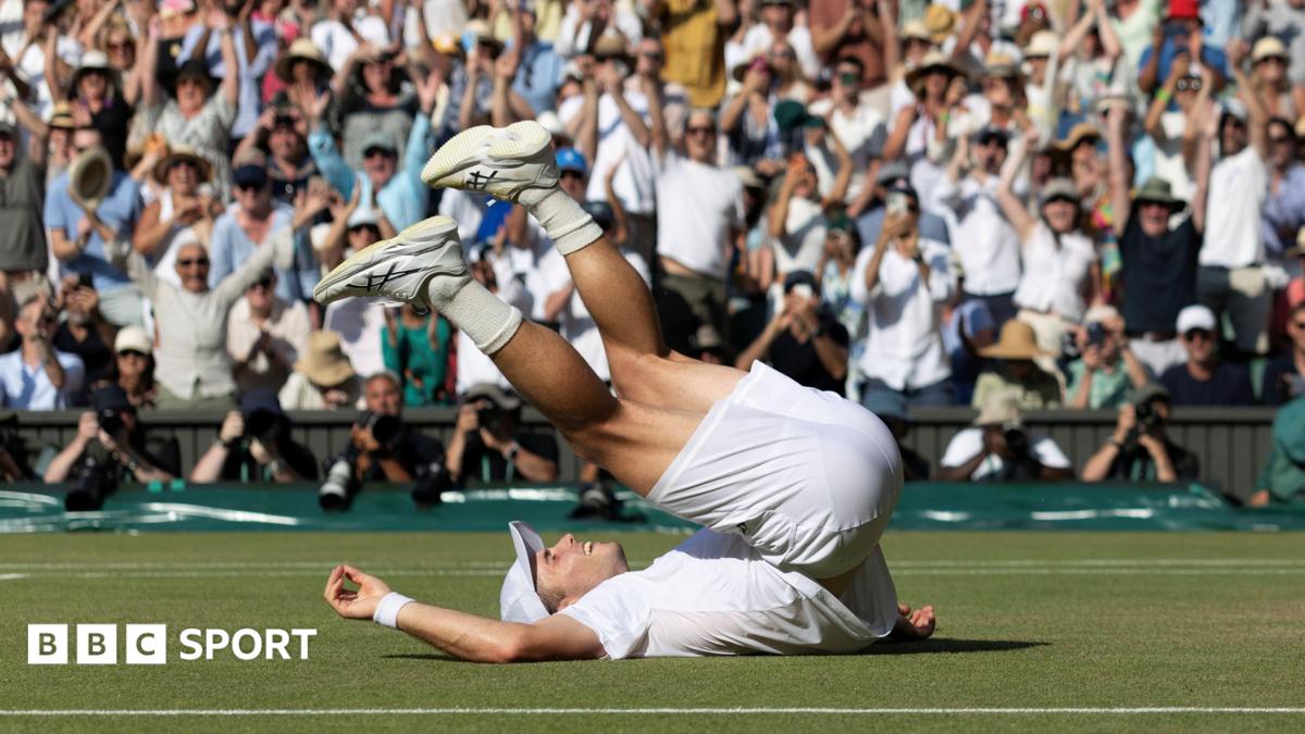Arthur Fery falls on his back after beating Flavio Cobolli at Wimbledon