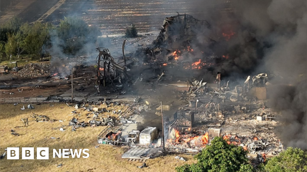 Twenty firefighters taken to hospital after explosion - BBC