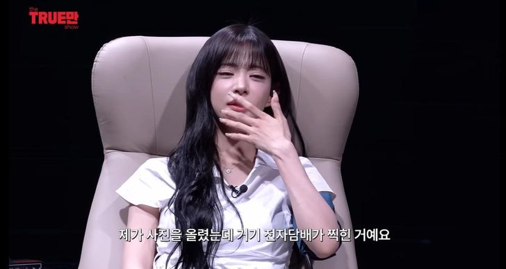 Lee Chae-young of K-pop girl group fromis_9 clarifies a false electronic cigarette rumor during an appearance on a YouTube talk show. Captured from Ipmanyulmyeon YouTube channel