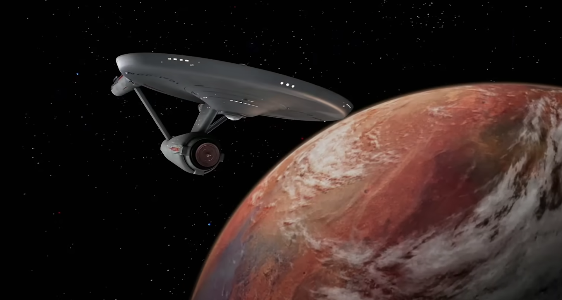 a starship flying past an orange planet