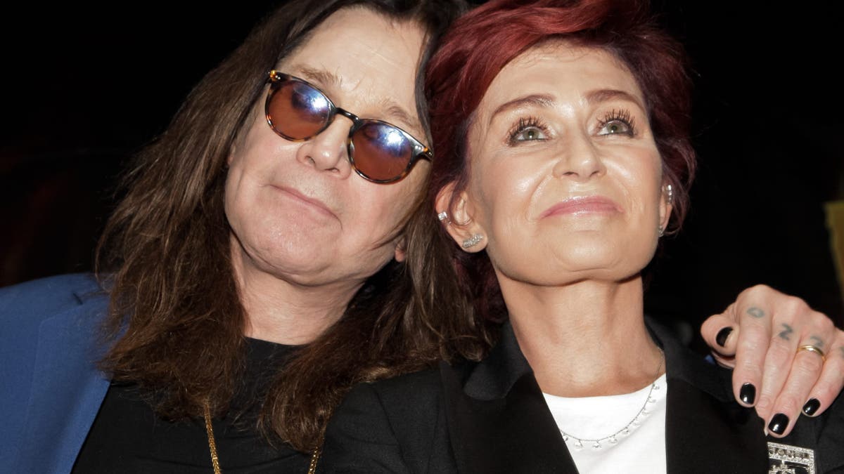 Ozzy Osbourne and Sharon Osbourne looking up at a press conference in Hollywood