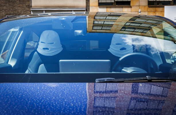 Can everyone please stop buying those balaclava headrests for their cars?