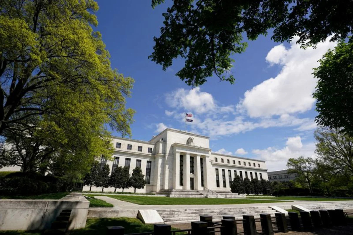 Dollar slips as Fed holds rates steady