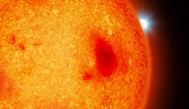 An artist’s impression of a red dwarf with a white dwarf binary companion peeking out from behind. Image credit: Mark A. Garlick / University of Warwick.
