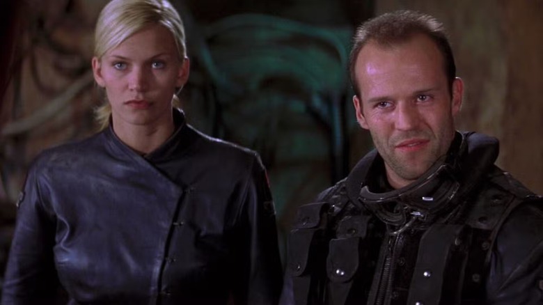 Melanie (Natasha Henstridge) and Jericho (Jason Statham) standing next to each other in 