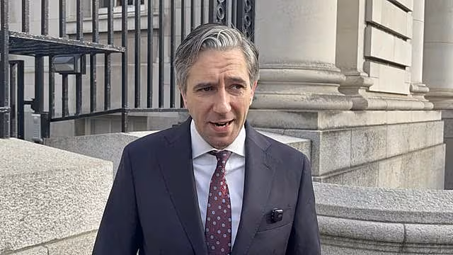 Tánaiste Simon Harris speaks to the media outside Government Buildings in Dublin