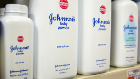 Bottles of Johnson & Johnson baby powder line a drugstore shelf in New York October 15, 2015. REUTERS/Lucas Jackson/File Photo