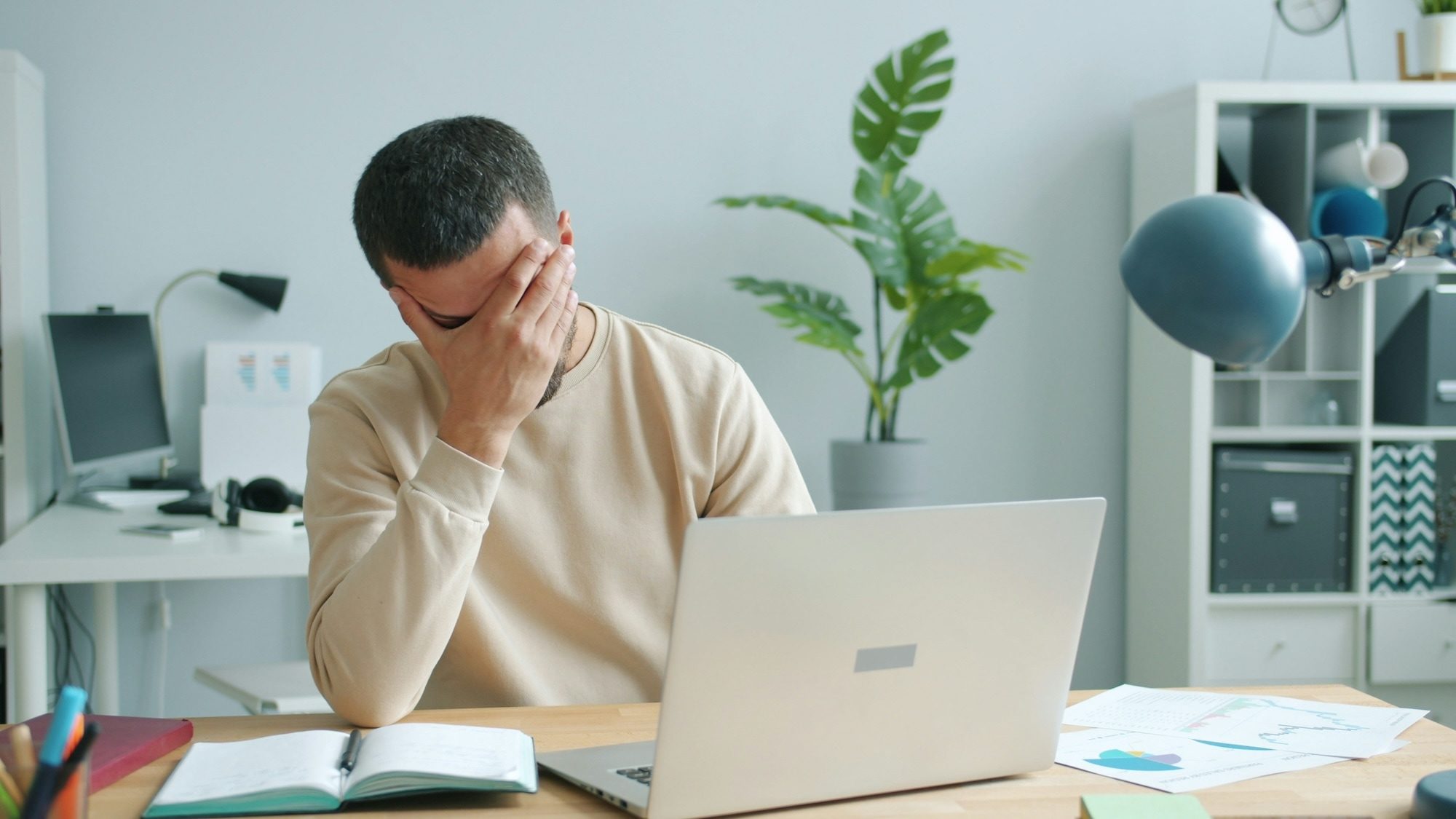man frustrated at using computer