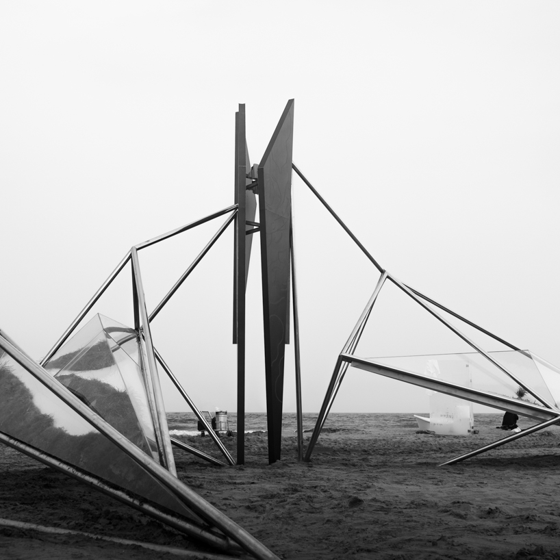 interconnected metal rods form a luminous winged installation on china's coastline - 5