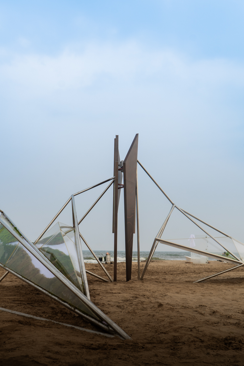 interconnected metal rods form a luminous winged installation on china's coastline - 4