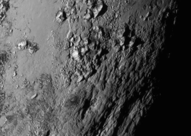 Signs of an Unknown Molecule Detected on The Surfaces of Pluto And Titan