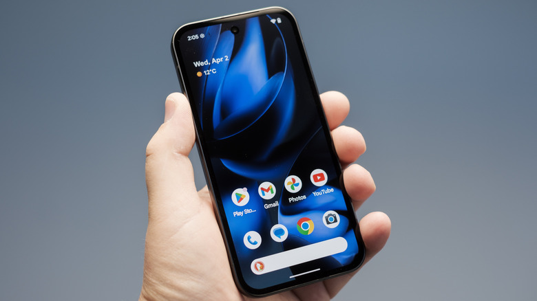 Person holding a Google Pixel 9 smartphone.