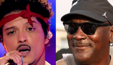 (L) Bruno Mars performs onstage during the 68th GRAMMY Awards at Crypto.com Arena on February 01, 2026 in Los Angeles, California. (R)  Michael Jordan, NBA Hall of Famer and co-owner of 23XI Racing looks on in victory lane after Tyler Reddick, driver of the #45 Xfinity Toyota, wins the NASCAR Cup Series Goodyear 400 at Darlington Raceway on March 22, 2026 in Darlington, South Carolina.