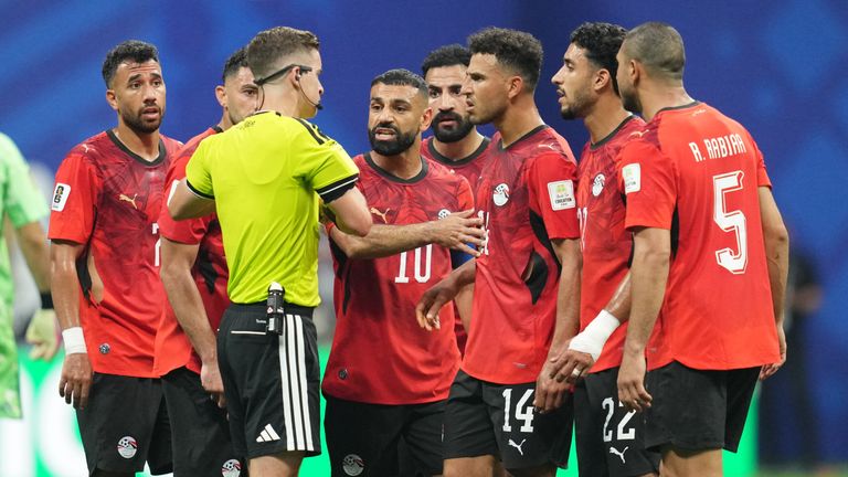 Egypt crowd the referee during their loss to Argentina